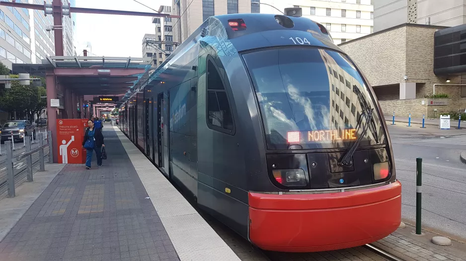Houston tram line Red with low-floor articulated tram 104 at Dryden/TMC (2018)