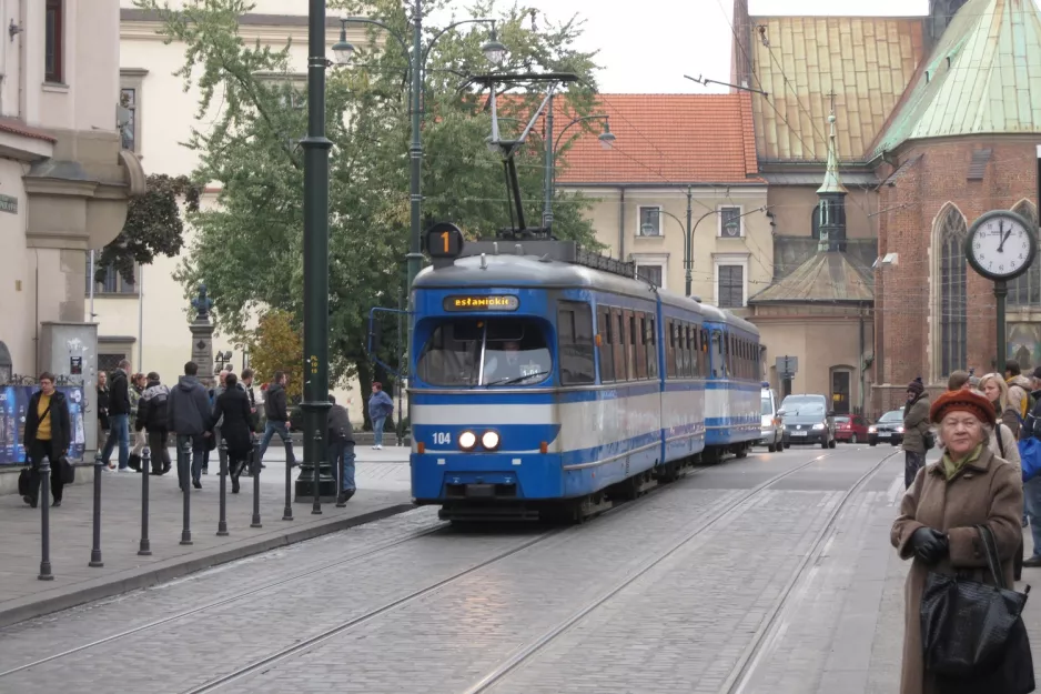 Kraków tram line 1 with articulated tram 104 on Plac Wszystkich Świętych (2011)