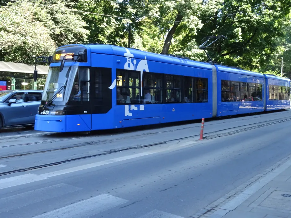 Kraków tram line 10 with low-floor articulated tram HY872 at Poczta Główna (2024)