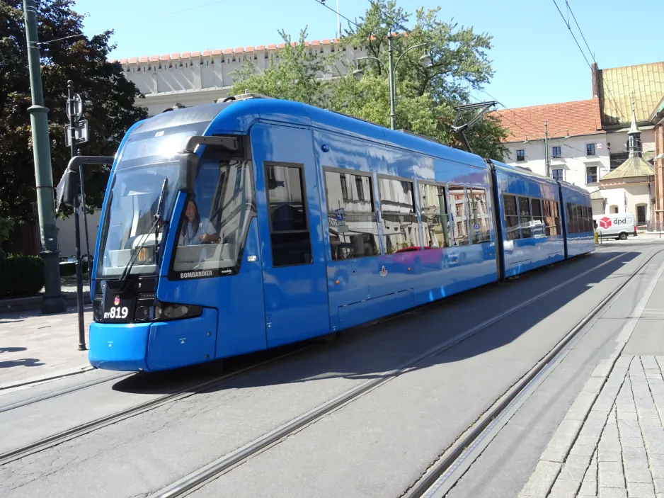 Kraków tram line 8 with low-floor articulated tram RY819 at Plac Wszystkich Świętych (2024)