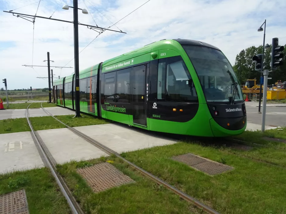 Lund tram line 1 with low-floor articulated tram 03 (Blåtand) near ESS (2022)