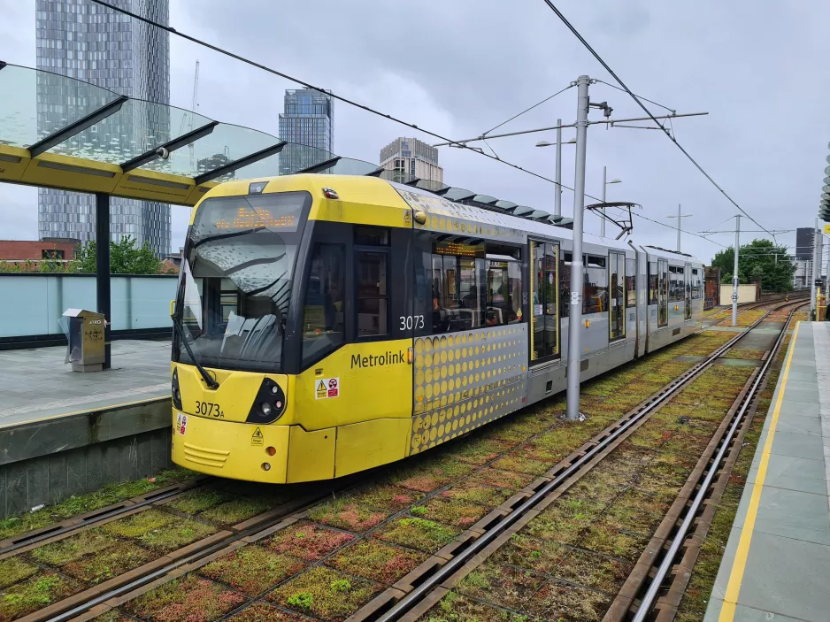 Manchester tram line Blue with articulated tram 3073 at Deansgate-Castlefield (2022)
