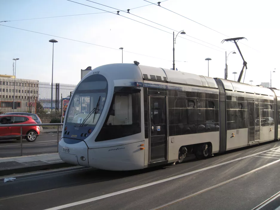 Naples tram line 1 with low-floor articulated tram 1115 on Via Amerigo Vecpucci, front view (2014)