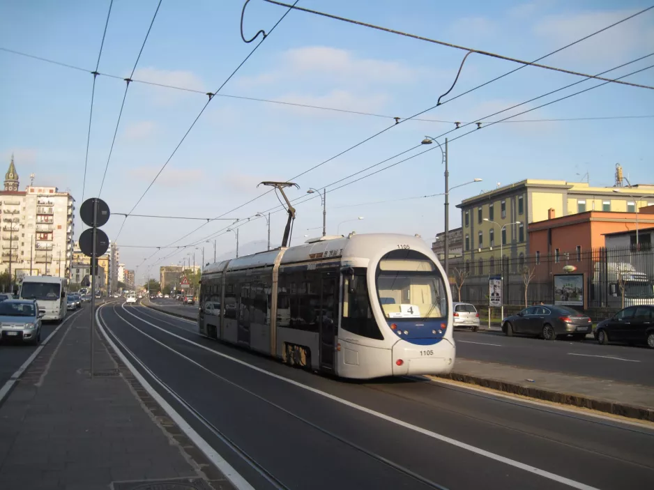 Naples tram line 4 with low-floor articulated tram 1105 on Via Amerigo Vecpucci, seen from the side (2014)