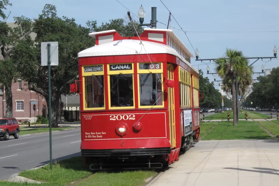 New Orleans line 47 Canal Streetcar with railcar 2002 on N Carrollton Avenue (2010)
