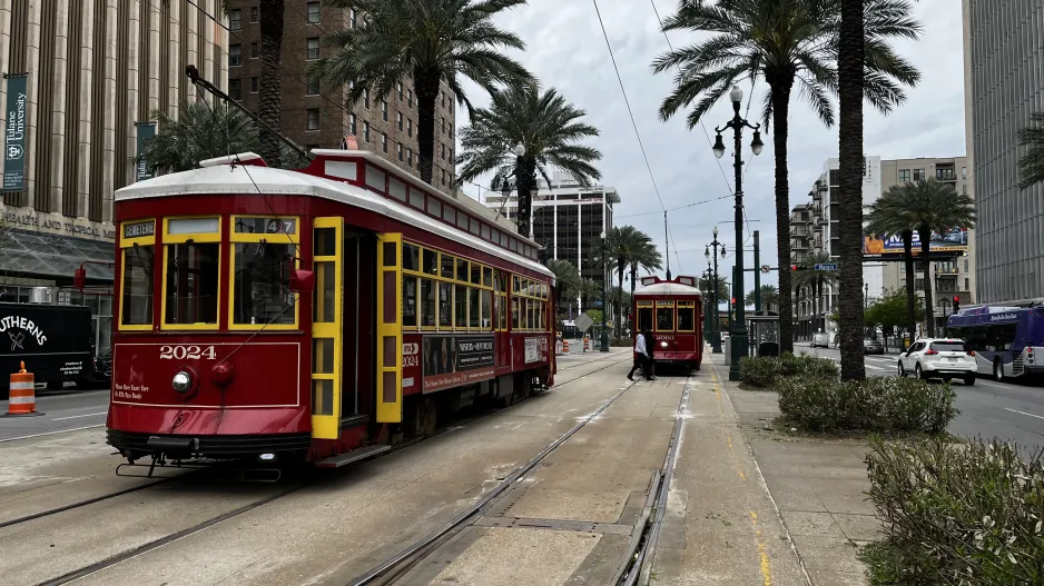 New Orleans line 47 Canal Streetcar with railcar 2024 near Canal / Lasalle (2024)