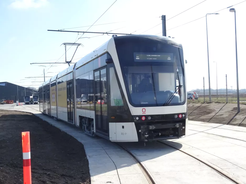 Odense low-floor articulated tram 01 "Brunneren" in front of Kontrol centret (2021)