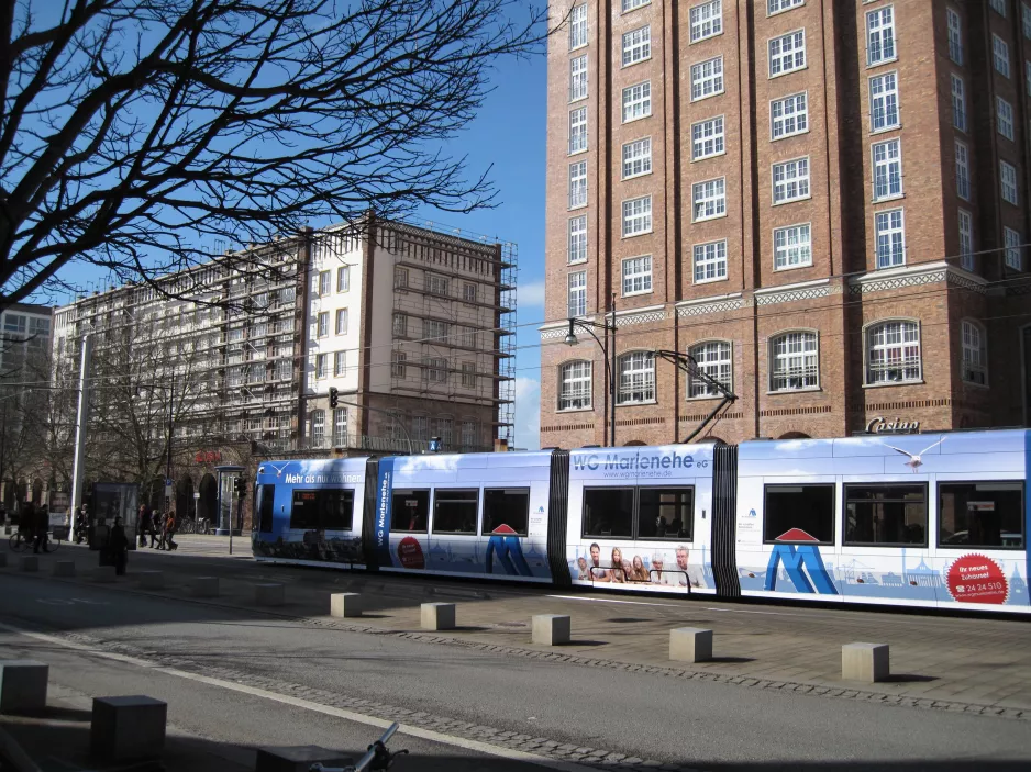Rostock tram line 1 with low-floor articulated tram 607 at Lange Straße seen from the side (2015)