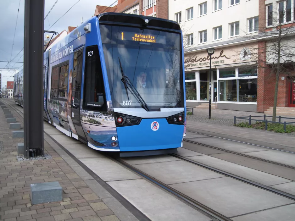 Rostock tram line 1 with low-floor articulated tram 607 near Steintor IHK (2015)