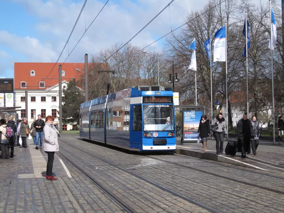 Rostock tram line 1 with low-floor articulated tram 676 at Neuer Markt (2015)
