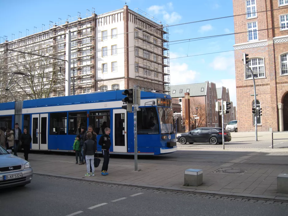 Rostock tram line 5 with low-floor articulated tram 665 in the intersection Lange Straße/Breite Straße (2015)