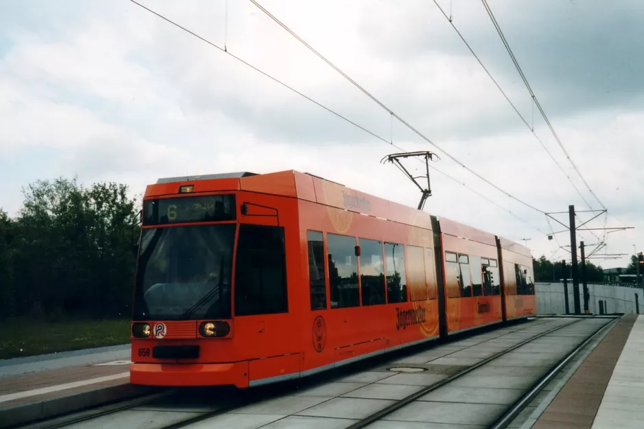 Rostock tram line 6 with low-floor articulated tram 658 close by Stadthalle (2004)