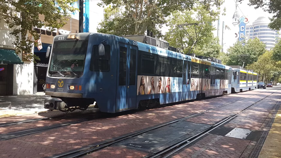 Sacramento tram line Blue with articulated tram 215 at St. Rose of Lima Park (2021)