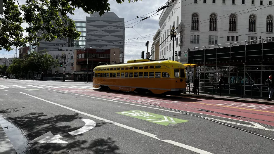 San Francisco F-Market & Wharves with railcar 1052 in the intersection Market St & Larkin St (2022)