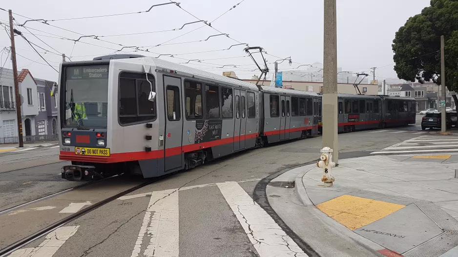 San Francisco tram line M Ocean View with articulated tram 1455 in the intersection 19th Ave & Randolph St (2019)