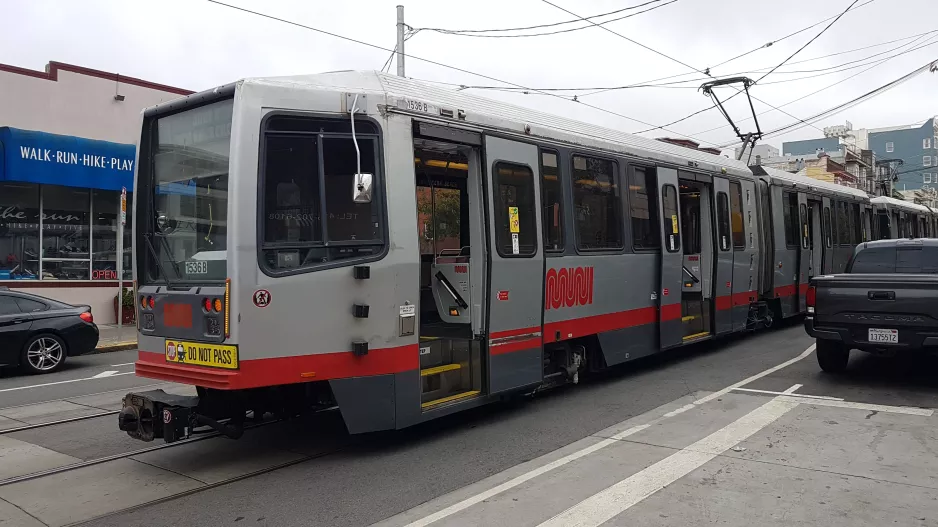 San Francisco tram line N Judah with articulated tram 1536 in the intersection 9th Ave & Irving St. (2021)