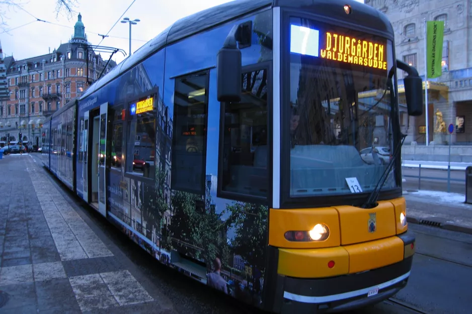 Stockholm tram line 7S Spårväg City with low-floor articulated tram 33 at Nybroplan (2012)