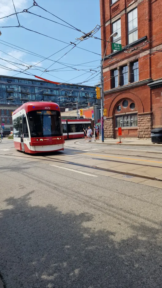 Toronto low-floor articulated tram 4572 close by Queen St E at Broadview (2024)