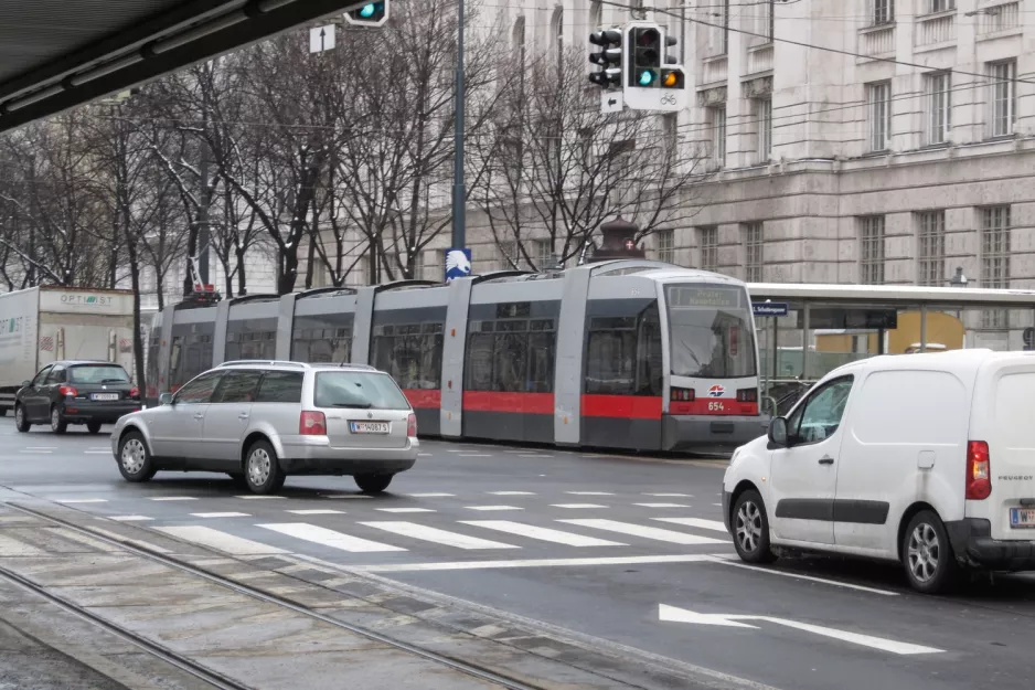 Vienna tram line 1 with low-floor articulated tram 654 on Schottenring (2013)