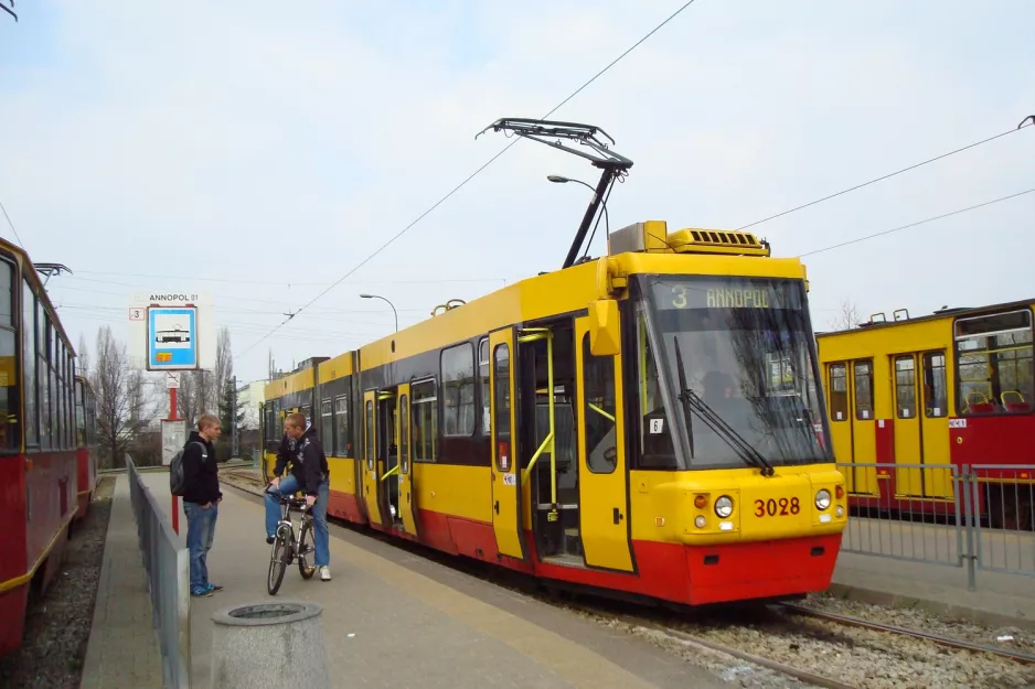 Warsaw tram line 3 with low-floor articulated tram 3028 at Annopol (2011)