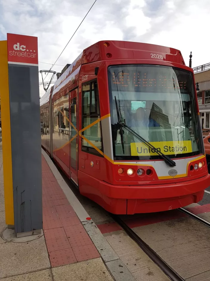 Washington, D.C. Streetcar with low-floor articulated tram 202 at H & 3rd (2016)