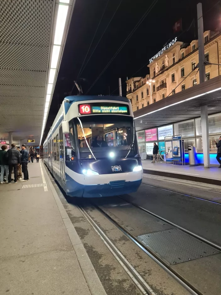 Zürich tram line 10 with low-floor articulated tram 3016 at Bahnhofplatz HB (2022)